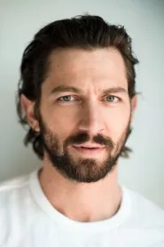 Michiel Huisman as Dawsey Adams in The Guernsey Literary & Potato Peel Pie Society