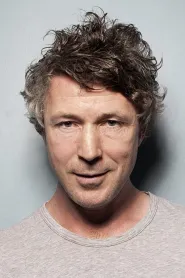 Aidan Gillen as John Reid in Bohemian Rhapsody