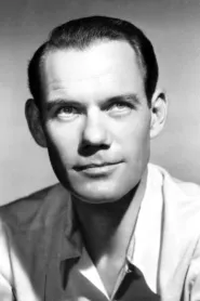 John Ridgely as Coroner in Un loc sub soare